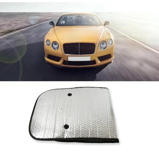 Foldable silver foil sun shade behind a car windshield, view 2