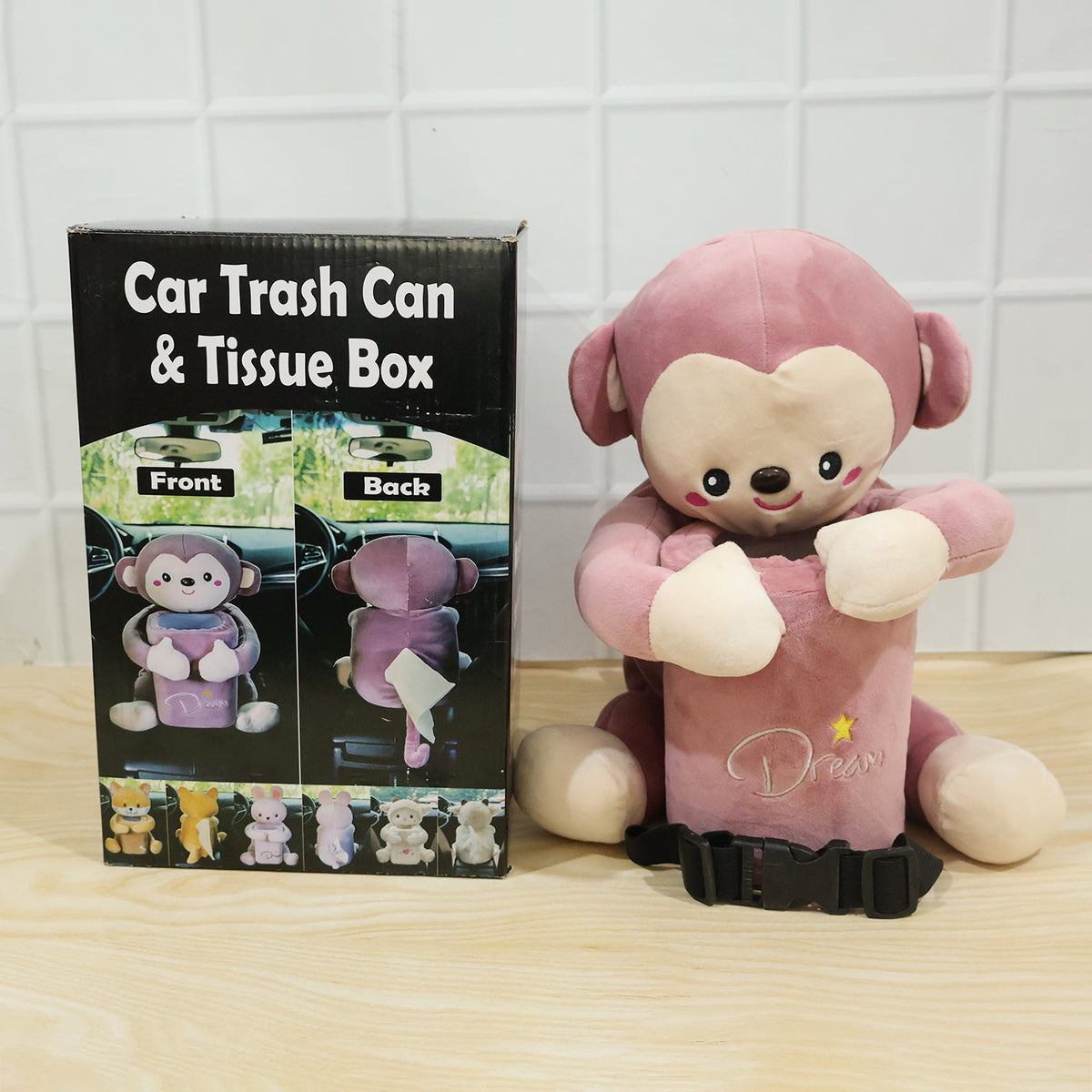 Pink plush monkey car dustbin and tissue holder strapped to a car seat, view 6