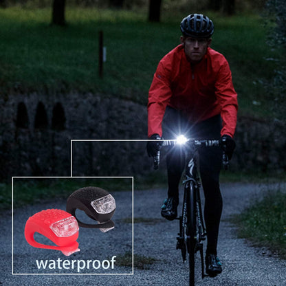 Two small silicone LED bicycle lights, front white and rear red, view 5