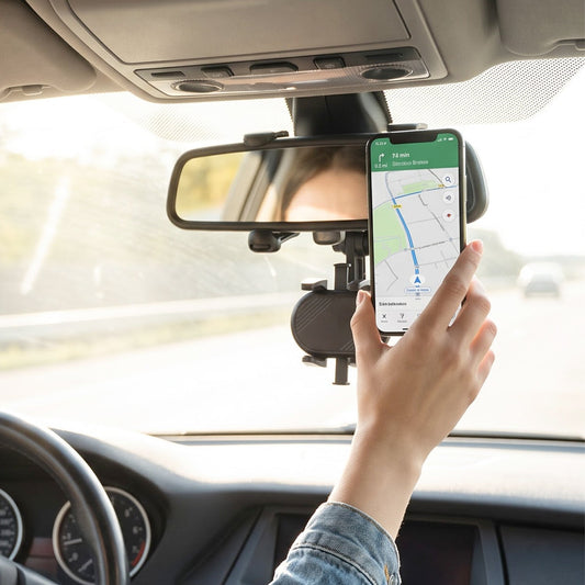 Car phone holder clamped to a rear view mirror holding a smartphone, view 2
