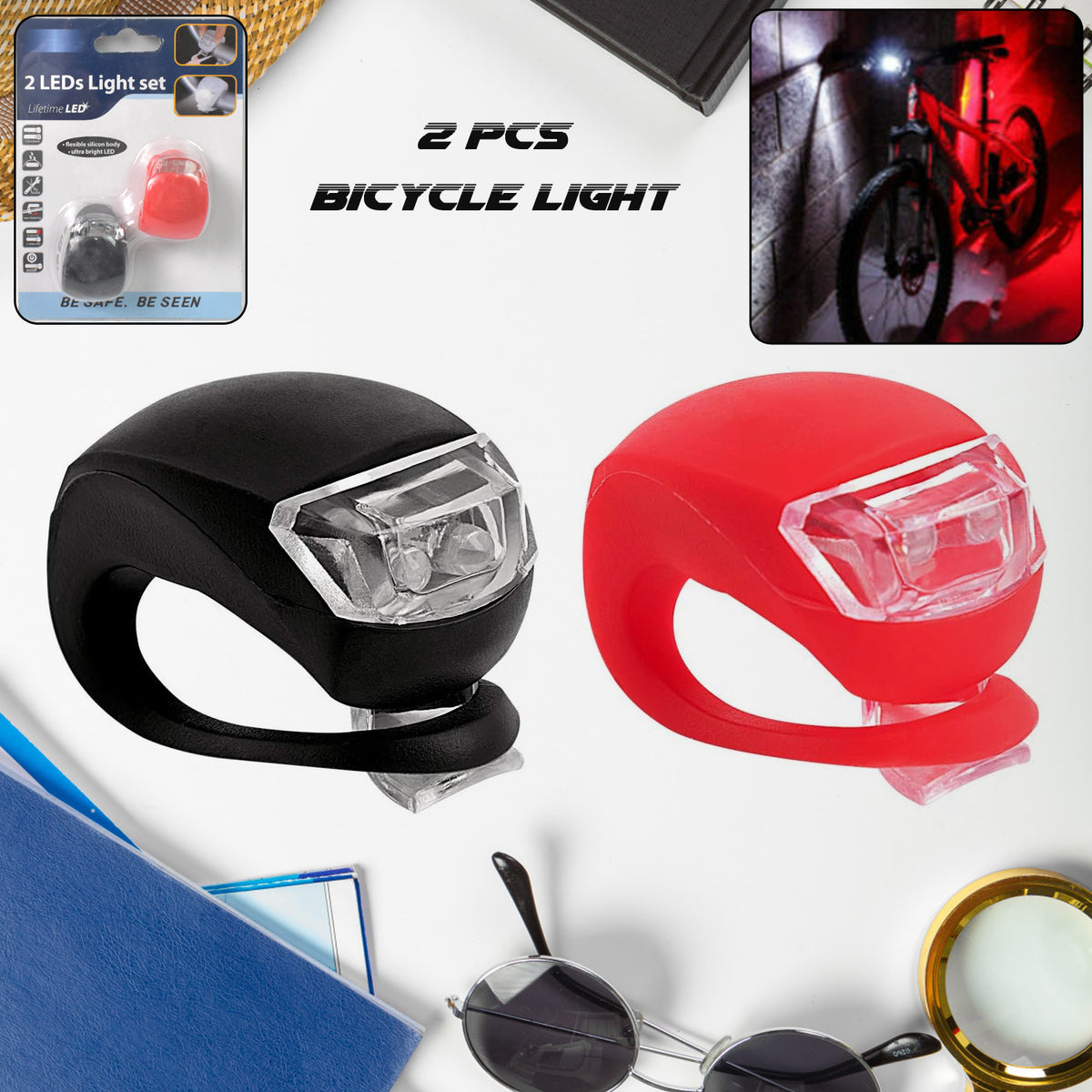 Two small silicone LED bicycle lights, front white and rear red