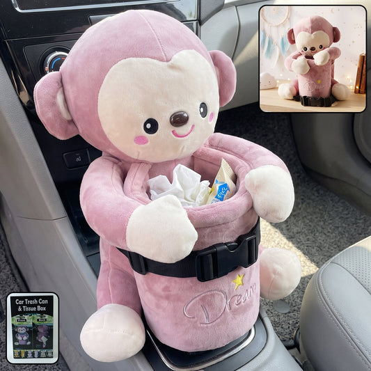 Pink plush monkey car dustbin and tissue holder strapped to a car seat
