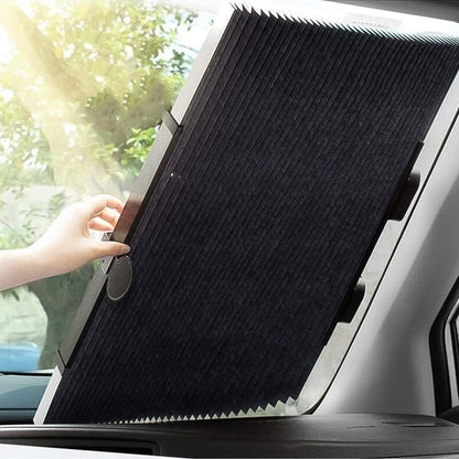Retractable roller sun shade fixed across a car windshield with suction cups, view 4