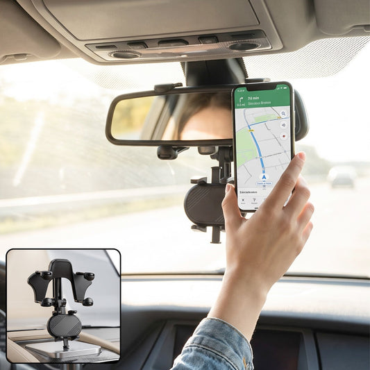 Car phone holder clamped to a rear view mirror holding a smartphone