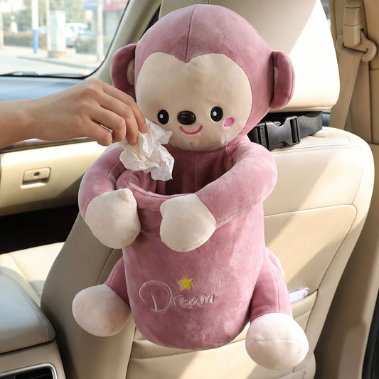 Pink plush monkey car dustbin and tissue holder strapped to a car seat, view 2