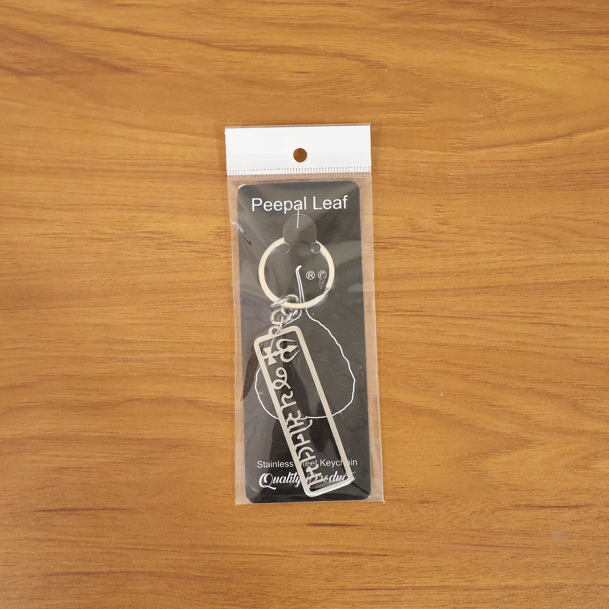 Rectangular metal Jay Sonal Ma keychain with trishul engraving, view 6