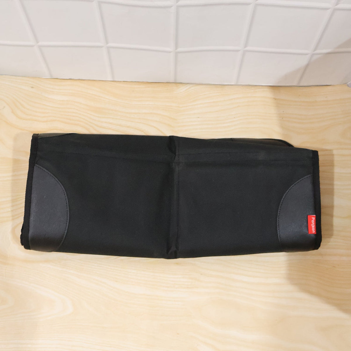 Black waterproof car seat protector mat under a child car seat, view 6