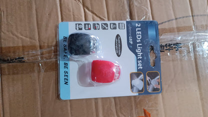 Two small silicone LED bicycle lights, front white and rear red, view 6