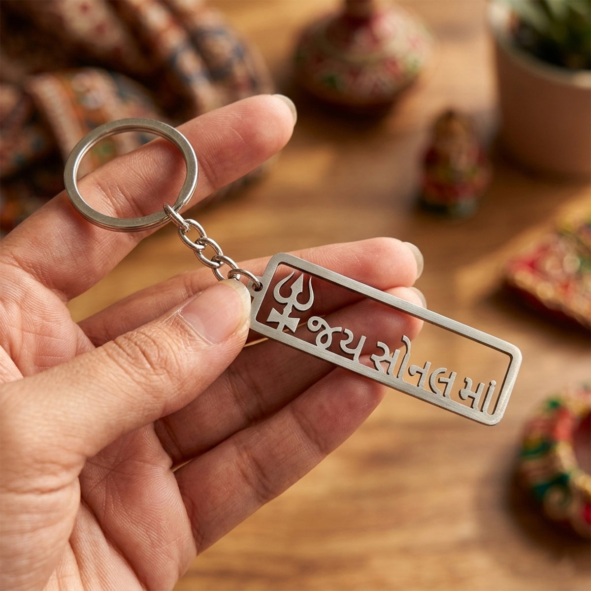 Rectangular metal Jay Sonal Ma keychain with trishul engraving, view 5