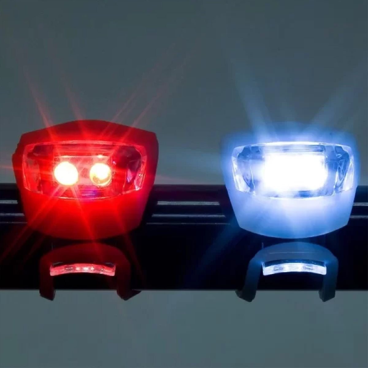 Two small silicone LED bicycle lights, front white and rear red, view 2