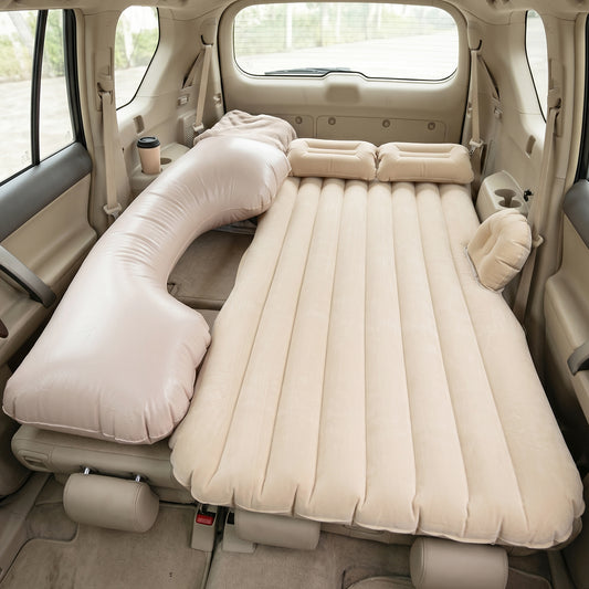 Beige inflatable car air mattress set up on a car back seat