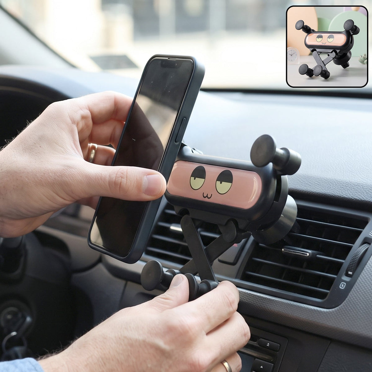 Cute decorative car phone holder clipped to an air vent