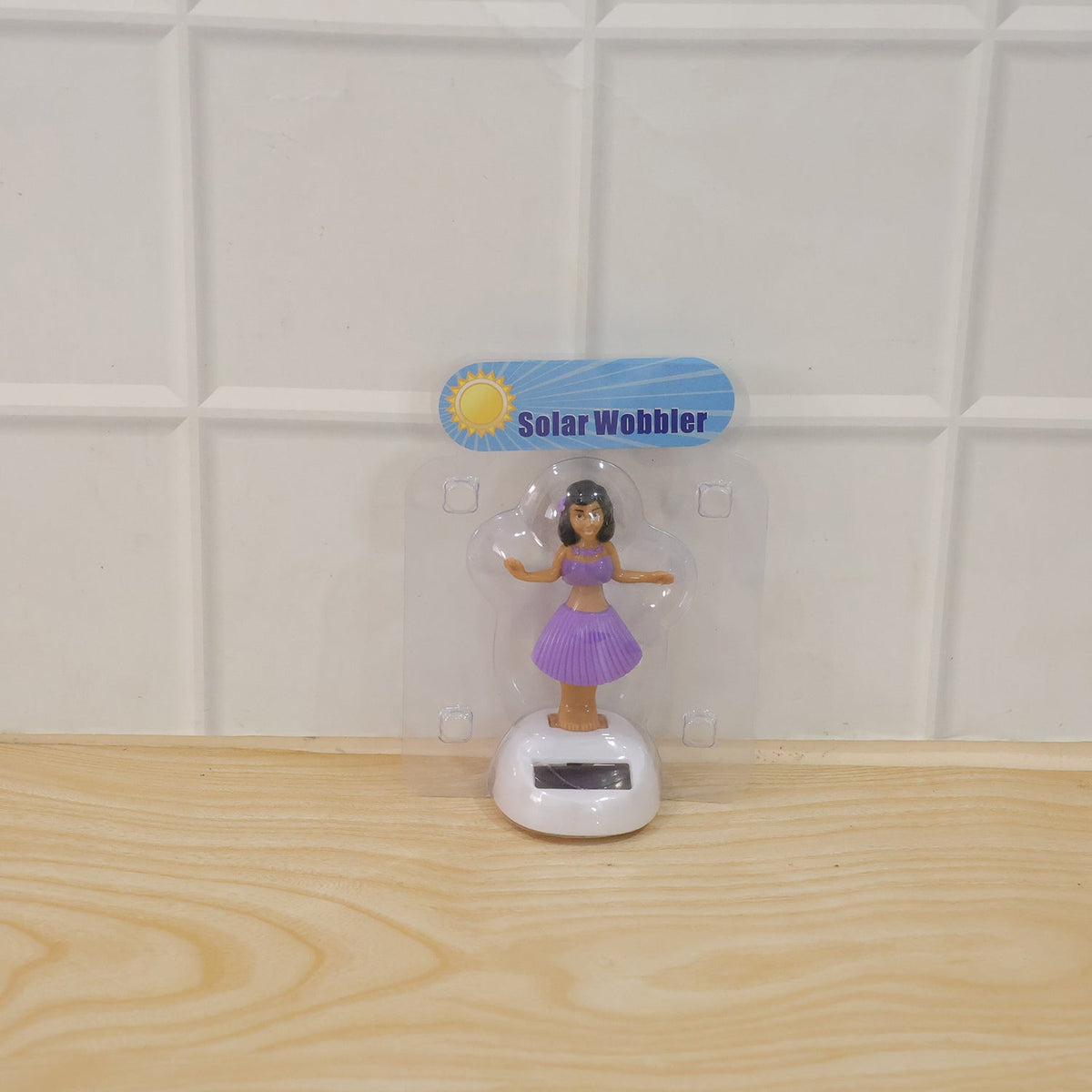 Solar powered dancing hula girl doll in purple dress on car dashboard, view 6