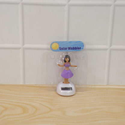 Solar powered dancing hula girl doll in purple dress on car dashboard, view 6