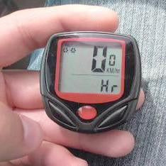 Wired bicycle computer with display, handlebar mount, sensor and spoke magnet