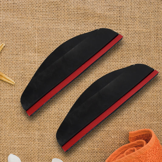 Pair of black rain guard visors fitted above car side mirrors