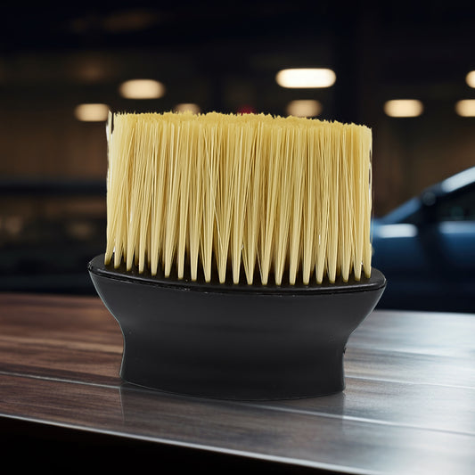 Soft long-bristle brush cleaning a car AC vent
