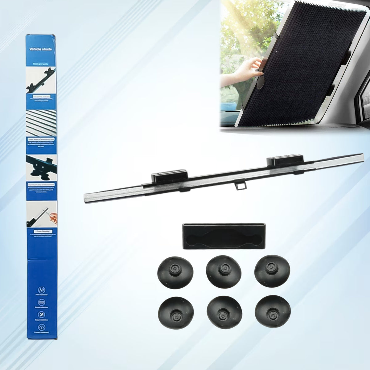 Retractable roller sun shade fixed across a car windshield with suction cups